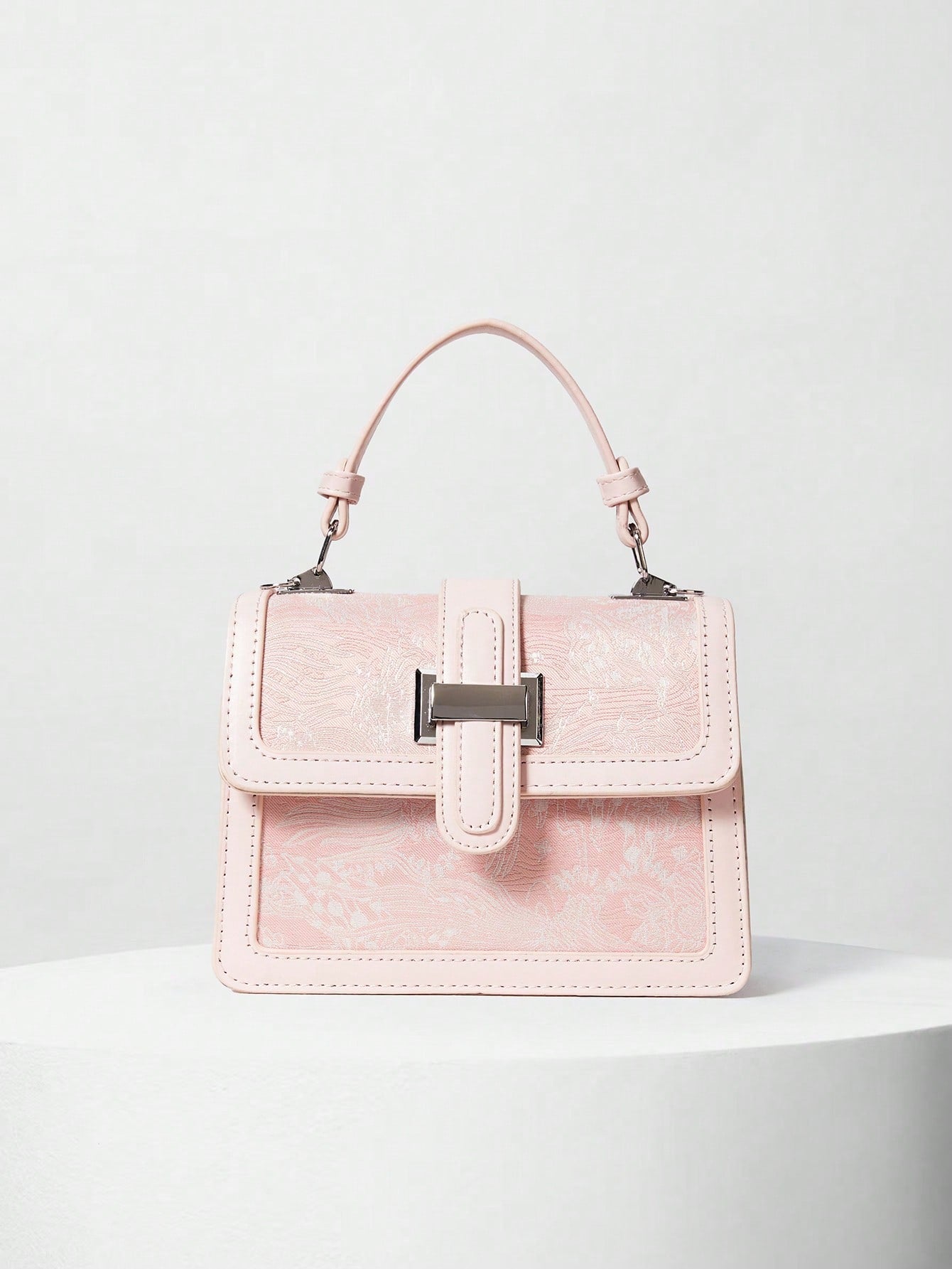 Introducing the cutest bag for your daily essentials - the Chic Mini Flower Graphic Square Bag! With a top handle and flap closure, this bag is both stylish and practical. The vibrant flower graphic adds a fun touch to your outfit. Show off your unique style with this bag (and receive compliments galore)!