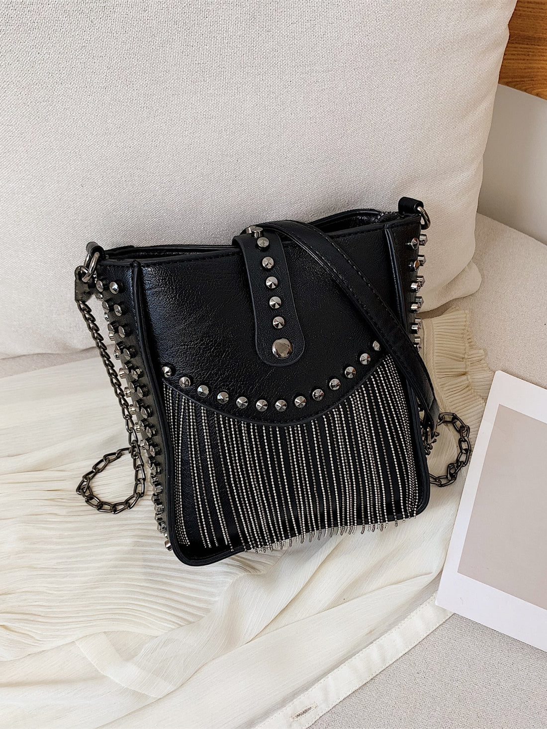 Elevate your style with our Chic Mini Fringe Studded Bucket Bag. Effortlessly add a touch of glamour with its unique studded design and trendy fringe detailing. This bag is perfect for any occasion, providing both style and convenience in a compact size. Complete your look with this must-have accessory.