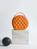 Add a dash of charm to your look with this Chic Mini Quilted Crossbody Bag. Its playful round shape and quilted texture blend style and fun, making it perfect for carrying your essentials hands-free. Whether out for errands or a night on the town, this compact handbag keeps you looking effortlessly cool and ready to go.