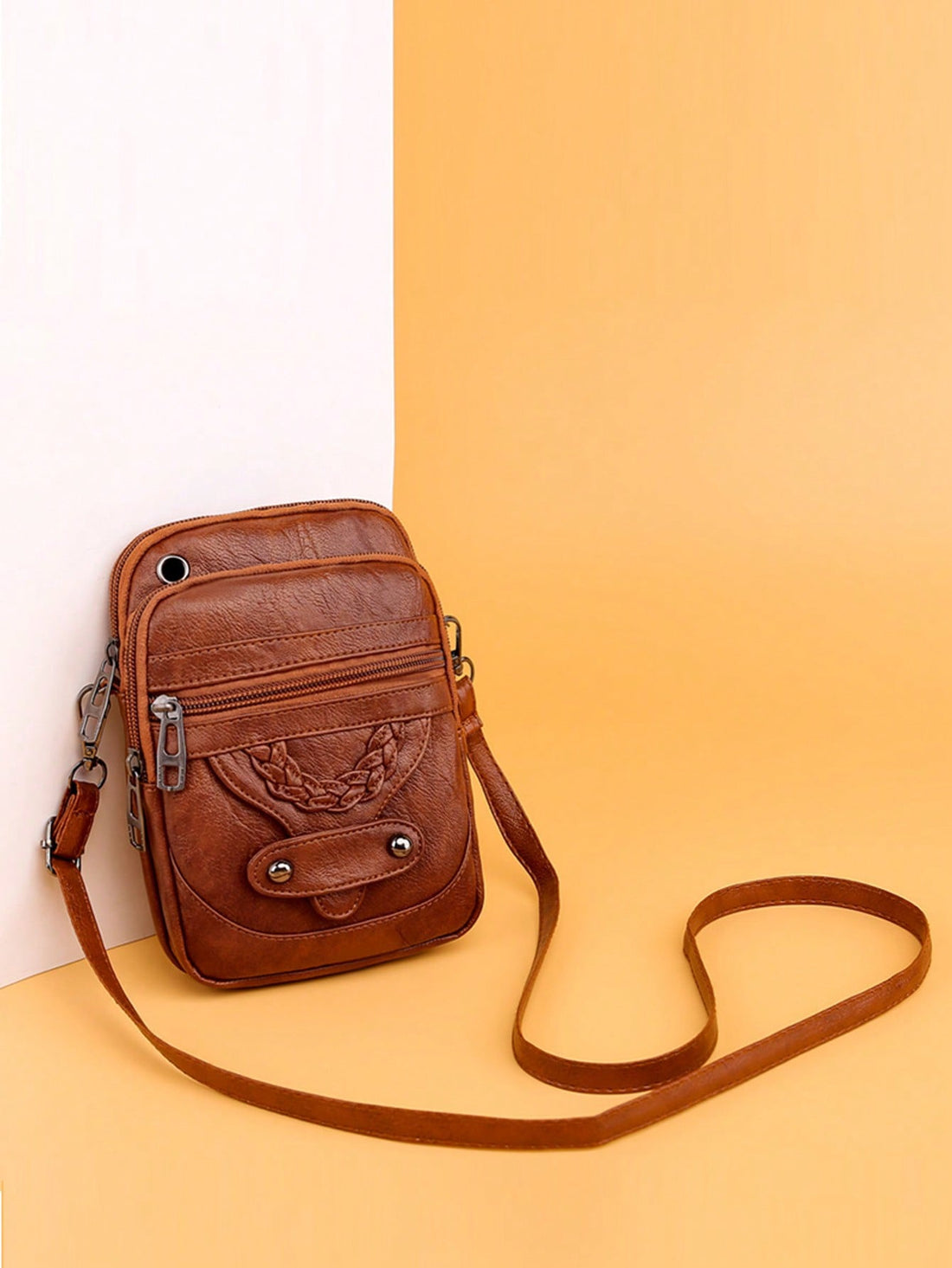 Stay chic, stylish and hands-free with our Mini Shoulder Bag! Featuring a trendy braid and rivet accents, this bag is perfect for shopping and travel. Make a fashion statement while staying organized and comfortable. It's the perfect accessory for any trendy shopper or jetsetter!