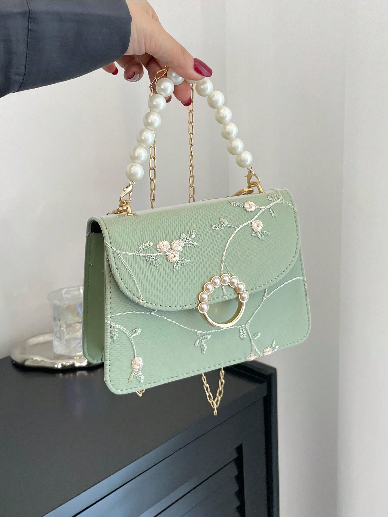This Chic Mini Square Bag is the perfect accessory to elevate any outfit. Made with flower embroidery and faux pearl accents, this bag adds a touch of elegance and sophistication to your look. Its compact size makes it perfect for carrying essentials while on the go. Experience luxury and style with every use.