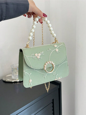 This Chic Mini Square Bag is the perfect accessory to elevate any outfit. Made with flower embroidery and faux pearl accents, this bag adds a touch of elegance and sophistication to your look. Its compact size makes it perfect for carrying essentials while on the go. Experience luxury and style with every use.