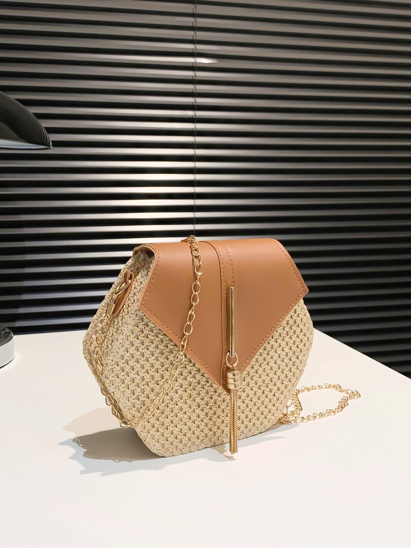 This mini tassel straw flap bag adds a stylish and chic touch to your summer outings. Made with high-quality materials, this bag is perfect for holding your essentials and completing your warm-weather look. With a trendy design and durable construction, this bag is the perfect accessory for any summer adventure.