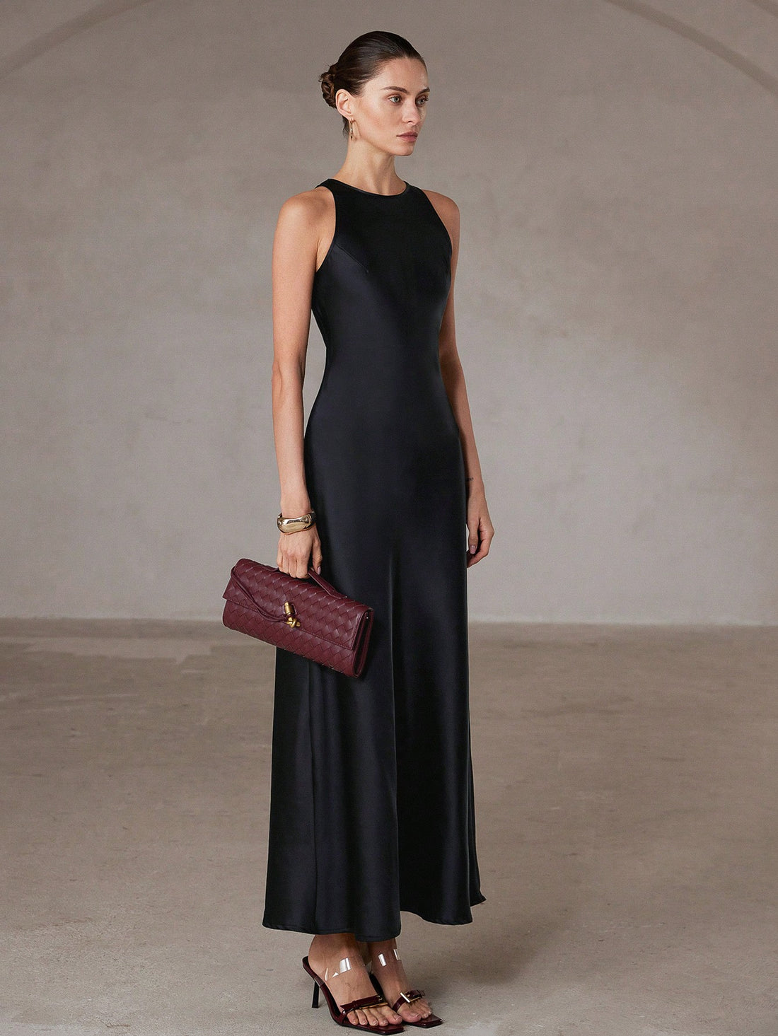 Step into effortless elegance with this chic minimalist A-line dress. Its asymmetric satin-like fabric adds a playful twist, while the sleeveless design keeps it light and flattering. Perfect for turning heads at any event, this long gown combines comfort with a touch of whimsy for your standout style.