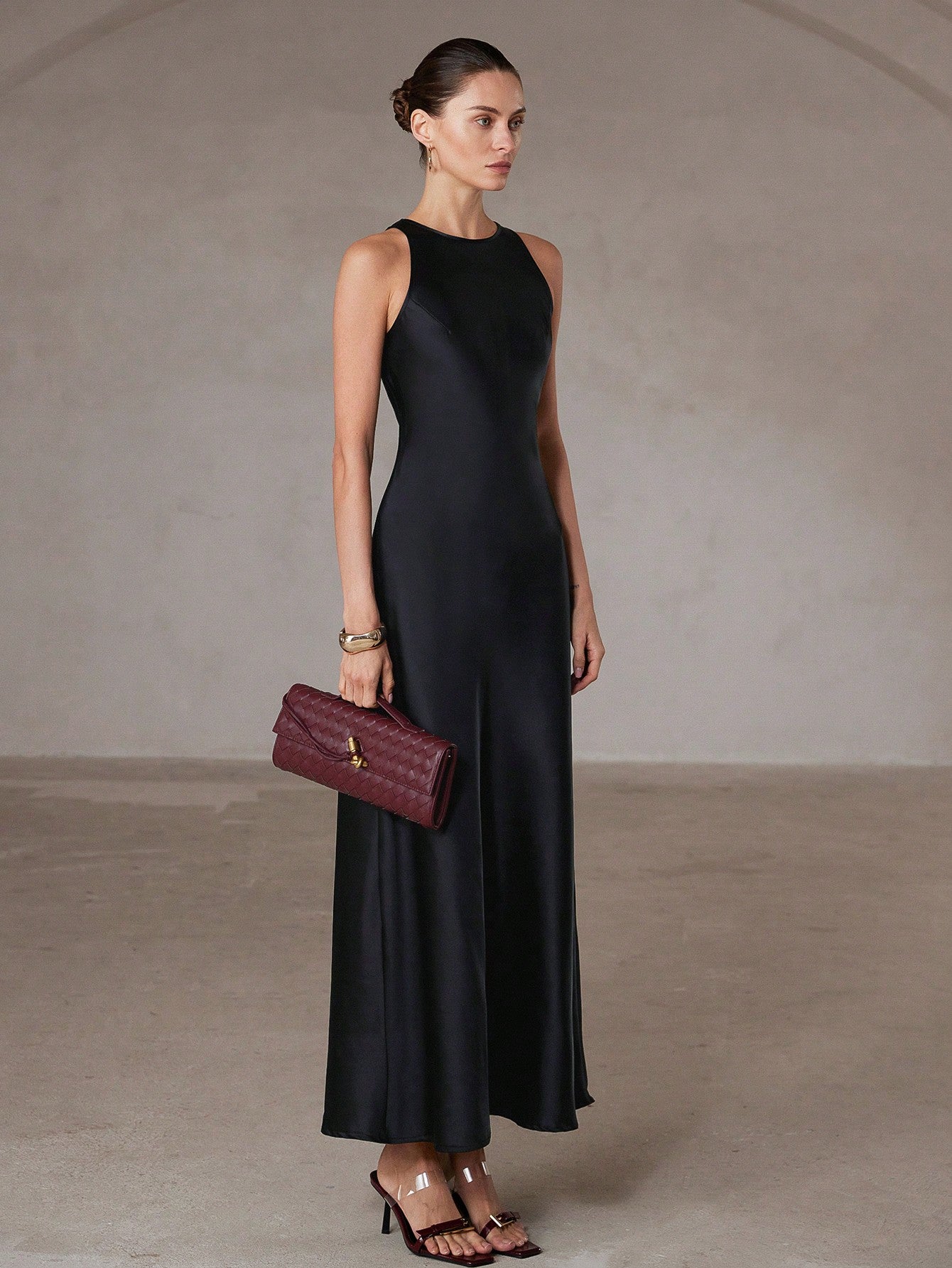 Step into effortless elegance with this chic minimalist A-line dress. Its asymmetric satin-like fabric adds a playful twist, while the sleeveless design keeps it light and flattering. Perfect for turning heads at any event, this long gown combines comfort with a touch of whimsy for your standout style.