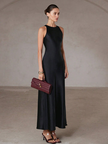 Step into effortless elegance with this chic minimalist A-line dress. Its asymmetric satin-like fabric adds a playful twist, while the sleeveless design keeps it light and flattering. Perfect for turning heads at any event, this long gown combines comfort with a touch of whimsy for your standout style.