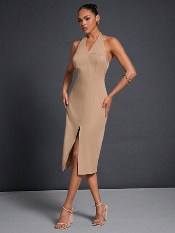 Step out in style with this chic minimalist mid-length dress, featuring a sleek zipper back for easy wear and a flirty split that adds just the right amount of flair. Perfect for dialing up your everyday look with effortless charm and a touch of fun. Whether you're running errands or meeting friends, this dress keeps it simple yet standout.