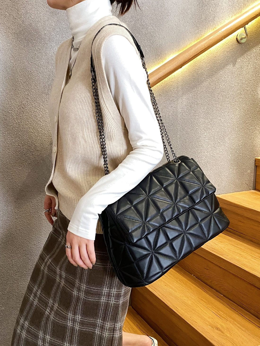 Elevate your everyday style with this chic quilted flap square bag—the perfect blend of minimalist design and maximum versatility. Its structured silhouette and quilted texture add sophisticated dimension to any outfit, while the convenient flap closure keeps your essentials secure. Whether you're heading to brunch, the office, or a night out, this compact yet spacious bag transitions seamlessly from day to night. The timeless square shape and neutral aesthetic make it a wardrobe staple that pairs effortles