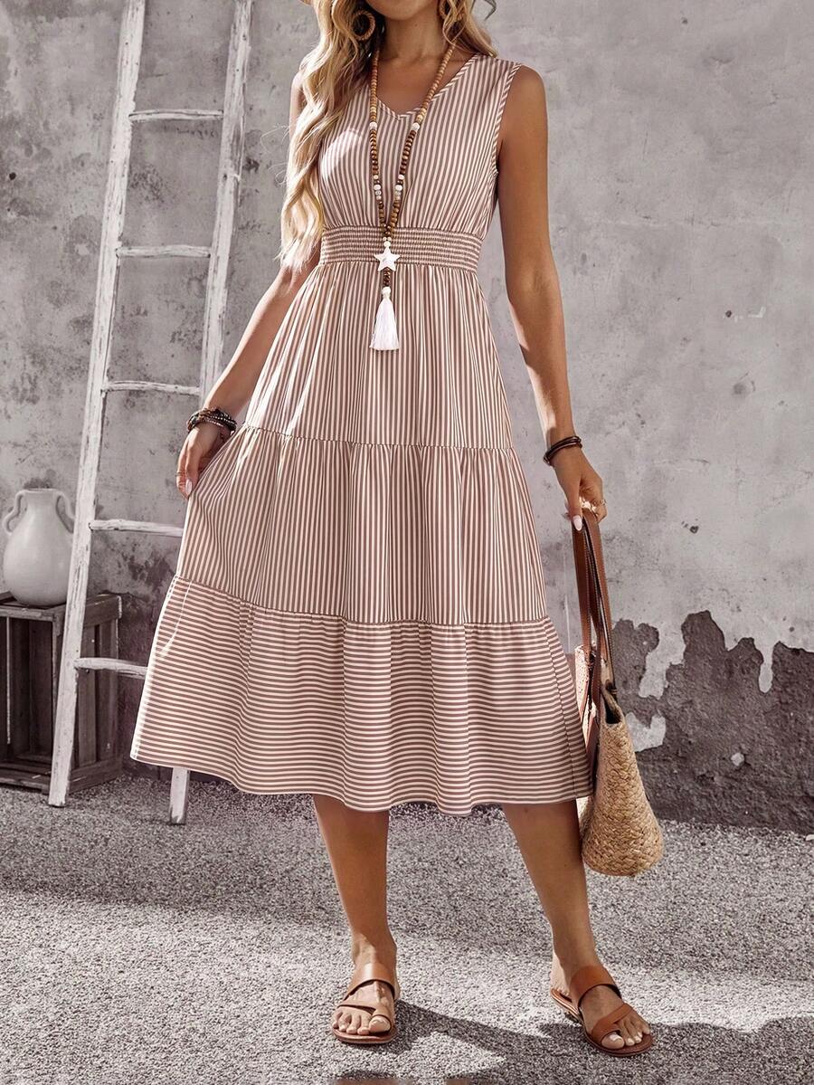 Front view of khaki sleeveless V-neck midi dress with shirred waist and tiered hem