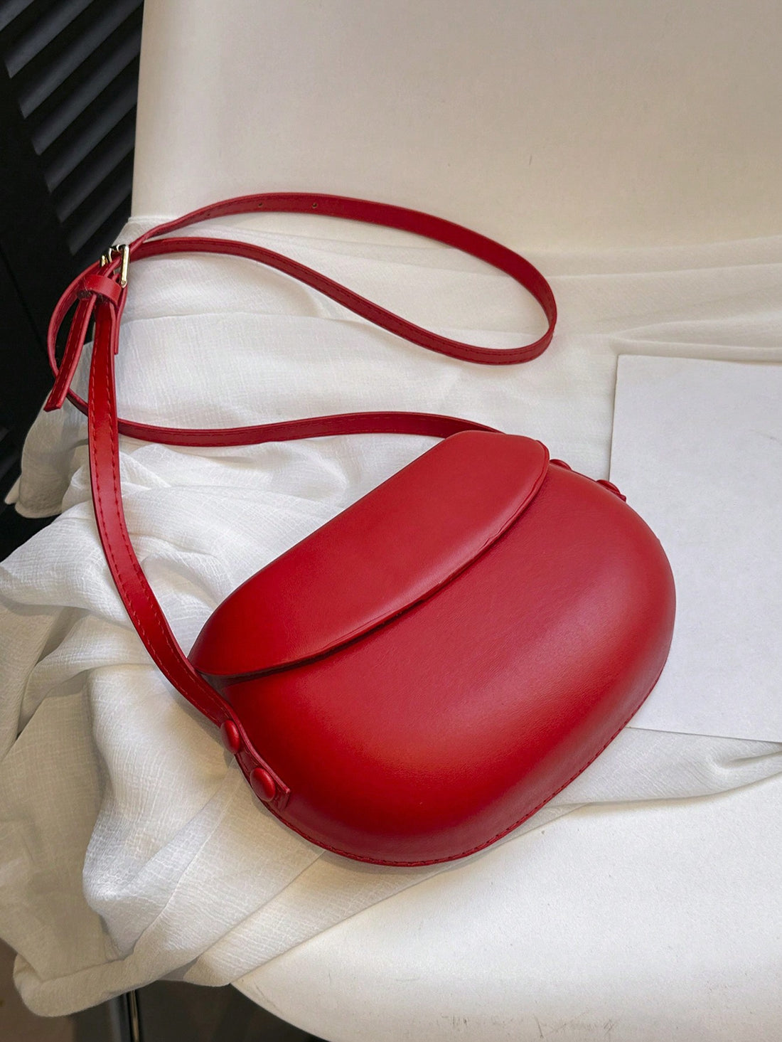 Experience everyday elegance with our Chic Minimalist Vintage Mini Saddle Bag. This adjustable crossbody bag boasts a stylish design and functional features, making it the perfect accessory for any outfit. Stay on trend without sacrificing practicality!