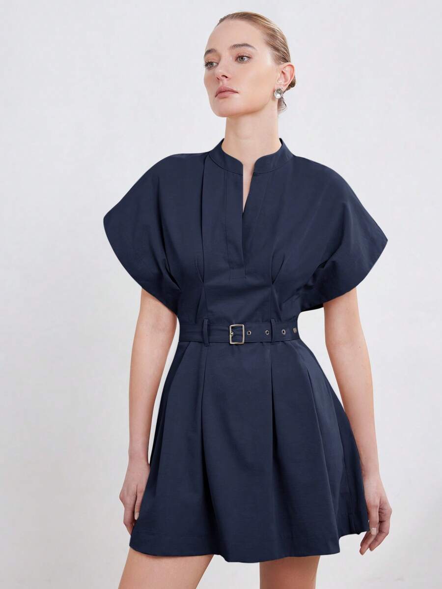 Master the Art of Professionalism in Our Chic Minimalist Fit and Flare Dress!

Redefine your workwear wardrobe with a silhouette that balances sharp tailoring with effortless femininity. This minimalist masterpiece is designed for the modern professional who values a polished, "power-dressing" aesthetic that transitions seamlessly from high-stakes boardrooms to evening city commutes.

Sophisticated Stand Collar: The clean, structured neckline adds an architectural touch of authority and elegance, offering a