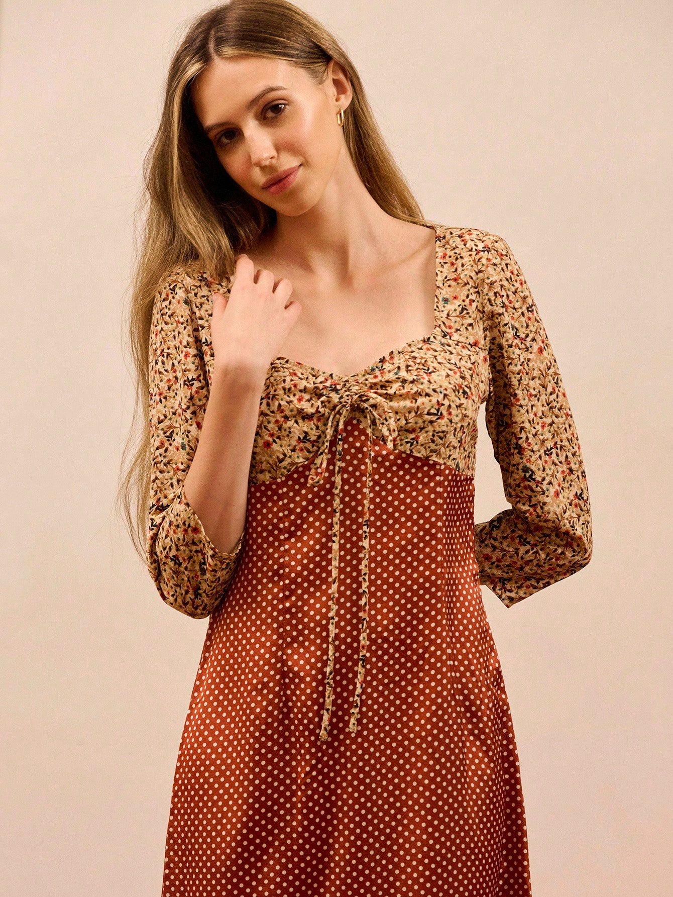 Elevate your fall wardrobe with this stunning mixed print maxi dress that effortlessly transitions from boardroom to brunch. The flattering tie-front detail cinches your silhouette while the 3/4 sleeves offer just the right amount of coverage for cooler days. Versatile enough to pair with blazers and heels for work, or dress down with sneakers for weekend vibes. This chic piece proves you don't have to choose between comfort and style—you can absolutely have both!