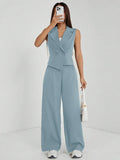 Elevate your fall wardrobe with this sophisticated navy blue two-piece set, expertly tailored for petite frames. The sleeveless top features a refined silhouette that pairs seamlessly with matching tailored pants, creating a polished look perfect for work, weekend outings, or casual gatherings. The timeless navy hue offers versatility—dress it up with heels and jewelry or keep it relaxed with sneakers and a cardigan. Quality construction ensures durability and comfort throughout the season.