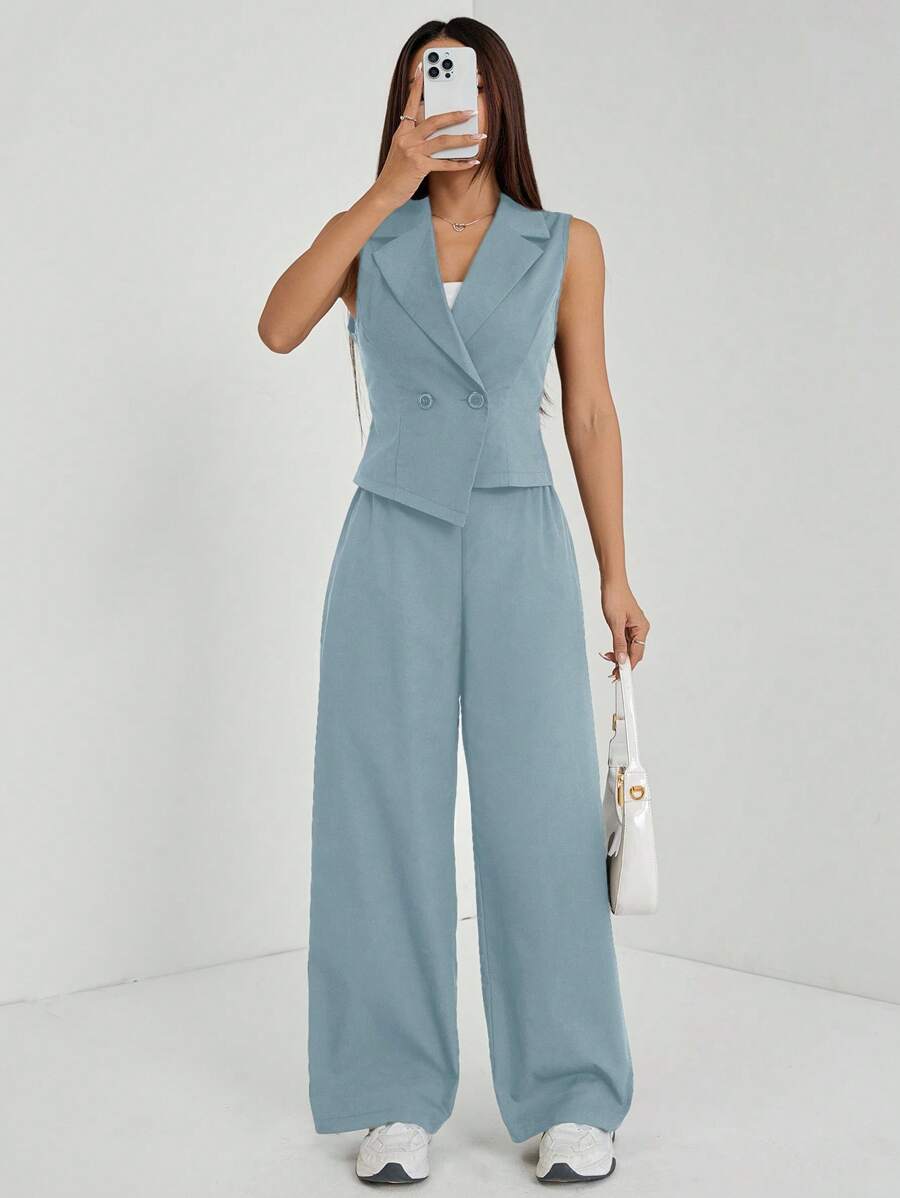 Elevate your fall wardrobe with this sophisticated navy blue two-piece set, expertly tailored for petite frames. The sleeveless top features a refined silhouette that pairs seamlessly with matching tailored pants, creating a polished look perfect for work, weekend outings, or casual gatherings. The timeless navy hue offers versatility—dress it up with heels and jewelry or keep it relaxed with sneakers and a cardigan. Quality construction ensures durability and comfort throughout the season.