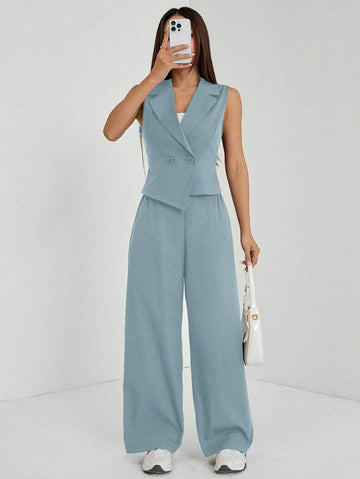 Elevate your fall wardrobe with this sophisticated navy blue two-piece set, expertly tailored for petite frames. The sleeveless top features a refined silhouette that pairs seamlessly with matching tailored pants, creating a polished look perfect for work, weekend outings, or casual gatherings. The timeless navy hue offers versatility—dress it up with heels and jewelry or keep it relaxed with sneakers and a cardigan. Quality construction ensures durability and comfort throughout the season.