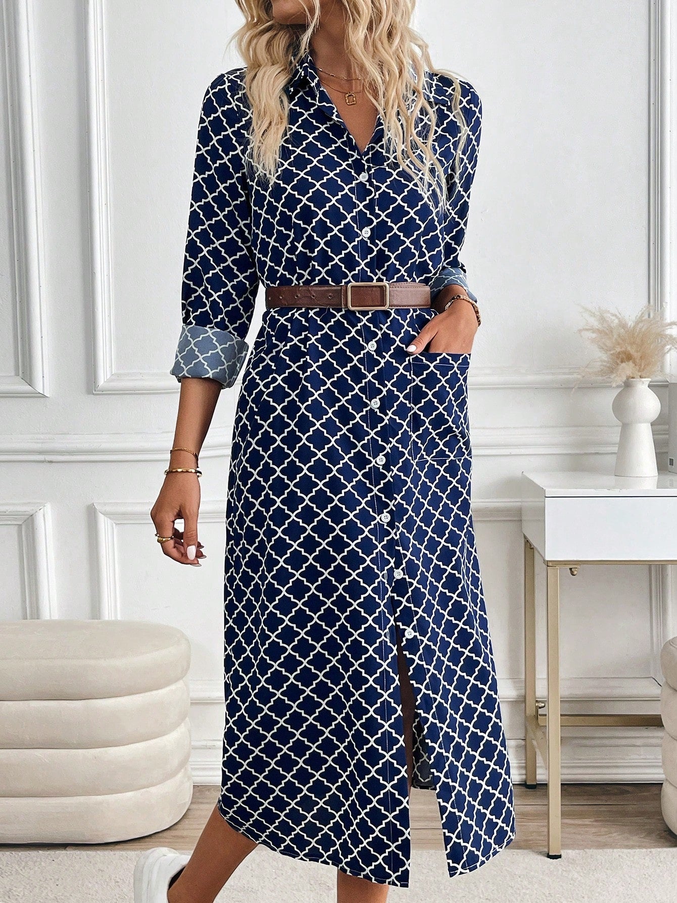 Effortlessly stylish and oh-so-chic, this navy blue plaid dress will become your new go-to favorite. Featuring convenient pockets and roll-up sleeves, this dress offers both fashion and function. Perfect for any occasion, this dress will keep you on-trend and looking fabulous.