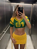 Model view of green yellow numeric knit crop top and drawstring mini skirt set