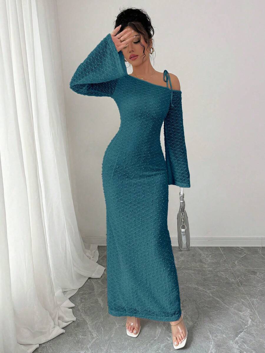 Turn heads this season in our off-shoulder bodycon maxi dress—the ultimate fall essential that hugs your curves in all the right ways. Crafted from soft, stretchy knit fabric, this stunner features long sleeves and a flattering silhouette that elongates your frame. The chic off-shoulder neckline adds a touch of effortless elegance, perfect for date nights, parties, or whenever you want to feel absolutely fabulous. Dress it up with heels or keep it casual with sneakers—this versatile piece does it all.