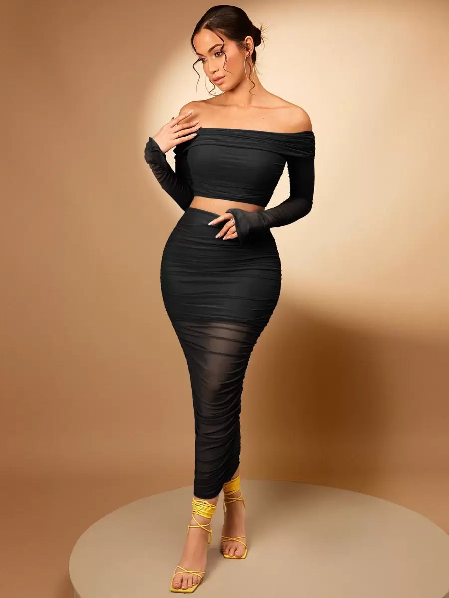 Turn heads with this flirty two-piece set that effortlessly combines trendy and timeless. The off-shoulder crop top shows just the right amount of skin with its chic silhouette, while the ruched pencil skirt hugs your curves in all the right ways. Perfect for date night, brunch with friends, or whenever you want to feel confident and fabulous. Mix and match with your favorite accessories to make it uniquely yours!