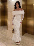 Full-length front view of fitted ivory floral evening gown and flared fishtail hem