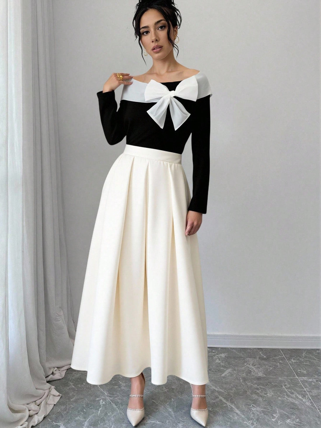 Elevate your seasonal wardrobe with this effortlessly chic two-piece set! The off-shoulder long sleeve top brings a flirty, modern edge while the flowing white maxi skirt keeps things relaxed and elegant. Perfect for layering through autumn and winter, this pairing works beautifully for casual outings, weekend brunches, or cozy evening strolls. Mix, match, or wear together—either way, you've got a versatile combo that feels both put-together and wonderfully comfortable. Embrace that breezy sophistication al