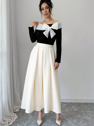 Elevate your seasonal wardrobe with this effortlessly chic two-piece set! The off-shoulder long sleeve top brings a flirty, modern edge while the flowing white maxi skirt keeps things relaxed and elegant. Perfect for layering through autumn and winter, this pairing works beautifully for casual outings, weekend brunches, or cozy evening strolls. Mix, match, or wear together—either way, you've got a versatile combo that feels both put-together and wonderfully comfortable. Embrace that breezy sophistication al