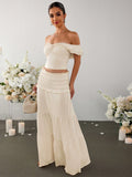 Turn heads this season in our effortlessly chic off-shoulder set! The ruched crop top hugs your curves in all the right ways, while the ruffled skirt adds a flirty, feminine touch that's perfect for summer adventures. Whether you're hitting the beach, catching sunset vibes, or dancing the night away, this dynamic duo delivers instant style without the fuss. Mix, match, or wear together—either way, you're guaranteed to feel confident and fabulous. Your go-to set for making every warm-weather moment count!