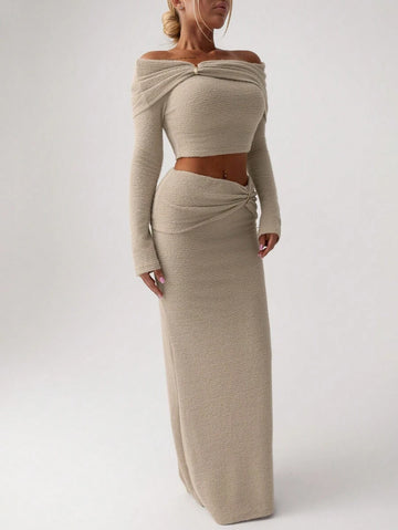 Turn heads with this stunning two-piece set that effortlessly blends sophistication with modern flair. The off-shoulder top features sleek metal accents that catch the light just right, while the fishtail skirt creates a flattering silhouette that moves with you. Perfect for date nights, parties, or whenever you want to feel absolutely fabulous. This is the outfit that says "I've got style and I know it"—without trying too hard.