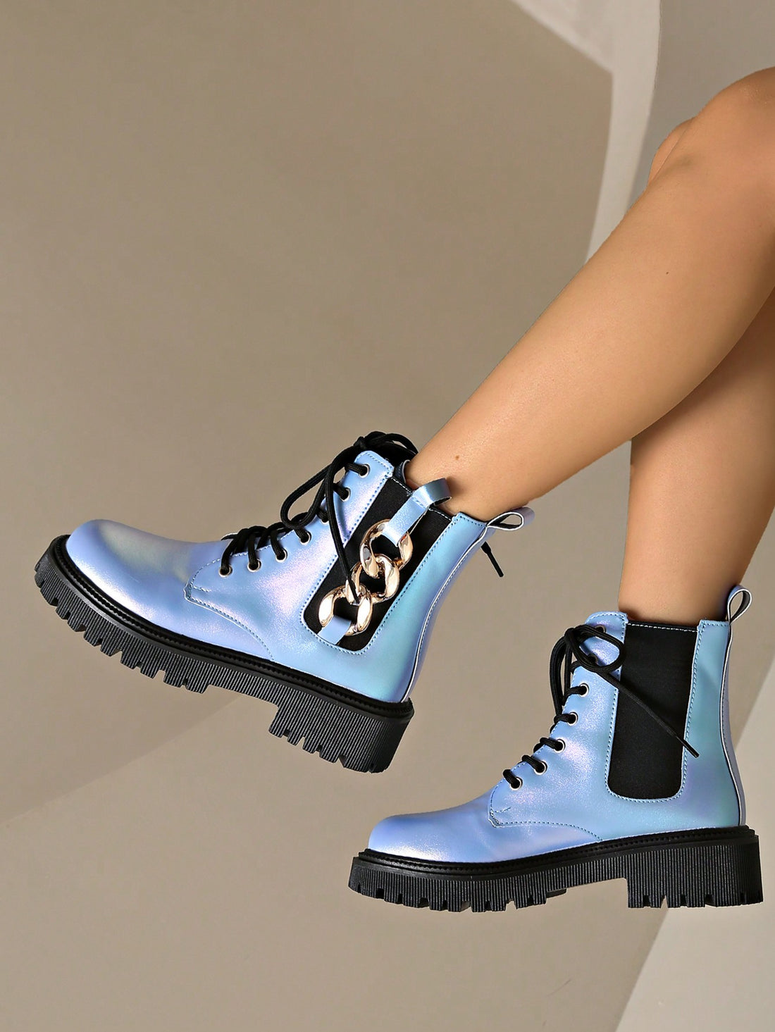 These Chic Ombre Blue Leather Ankle Boots boast a trendy motorcycle style perfect for the autumn/winter season. With a thick sole for added support and durability, these boots offer both fashion and functionality. The ombre blue leather adds a touch of uniqueness, making them a must-have for any stylish wardrobe.