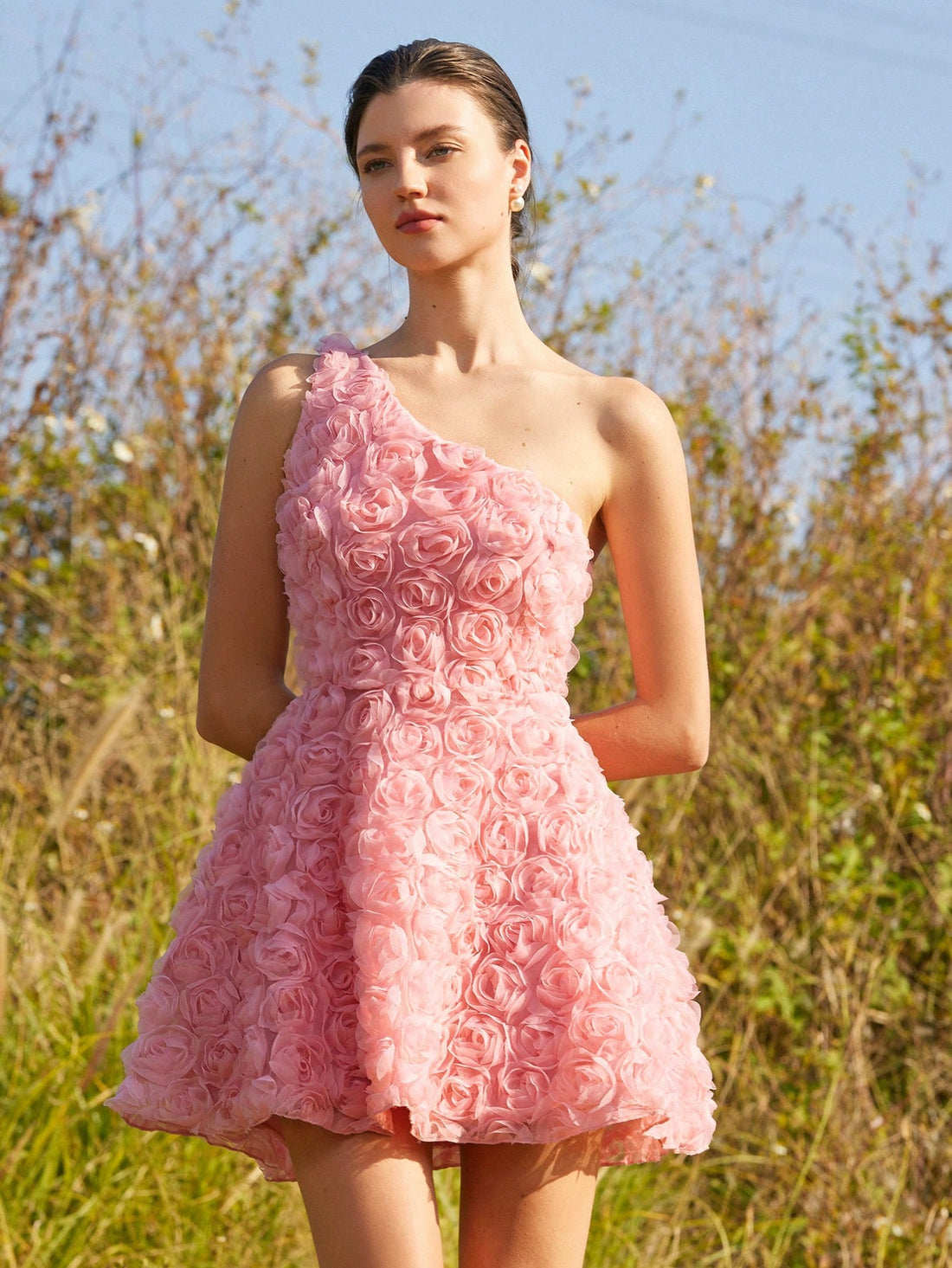 Get ready to turn heads in this chic one-shoulder mini dress! Featuring unique 3D floral accents, this dress is perfect for romantic occasions. You'll feel playful and flirty, making it the perfect choice for a night out with that special someone. Say goodbye to boring dresses and hello to a stand-out look!