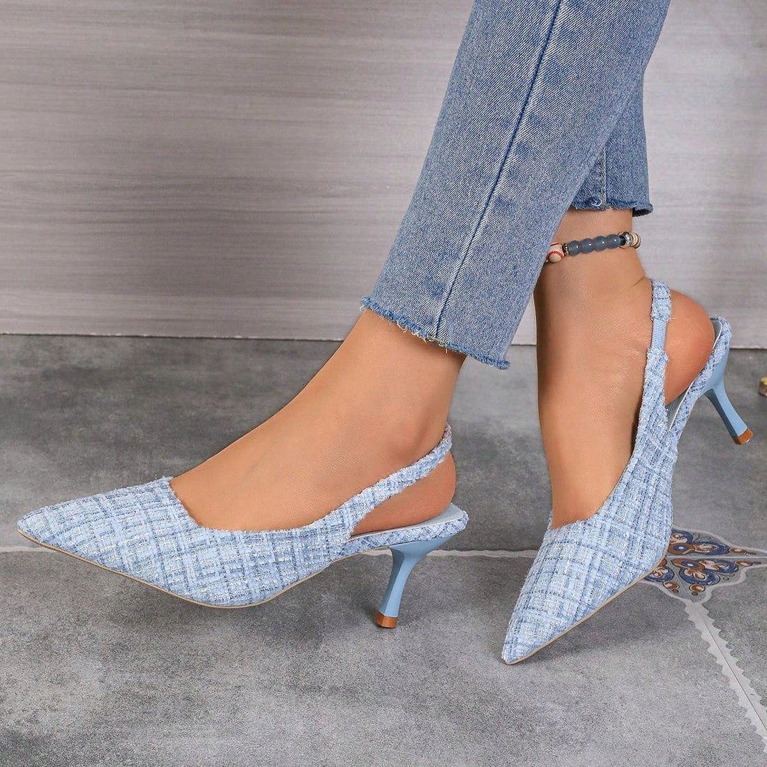 Introducing our Chic Open-Back Kitten Heel Sandals. Featuring a stylish pointed toe design and an elastic strap, these sandals are not only chic but also comfortable and easy to wear. Perfect for any occasion, elevate your outfit with these elegant and versatile sandals.