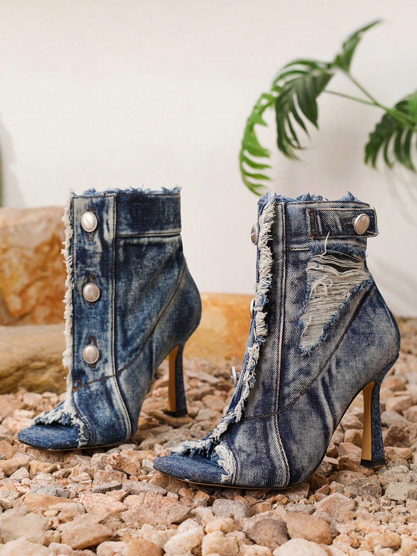 Step into the spotlight with these show-stopping open-toe ankle boots that blend edgy charm with sophisticated style. Featuring distressed detailing that adds character and movement, these high heels are your go-to for turning heads at parties and spring celebrations. The sleek silhouette elongates your legs while the open-toe design keeps things fresh and flirty. Whether you're dancing the night away or making a grand entrance, these boots deliver the perfect mix of attitude and elegance. Dress them up wit