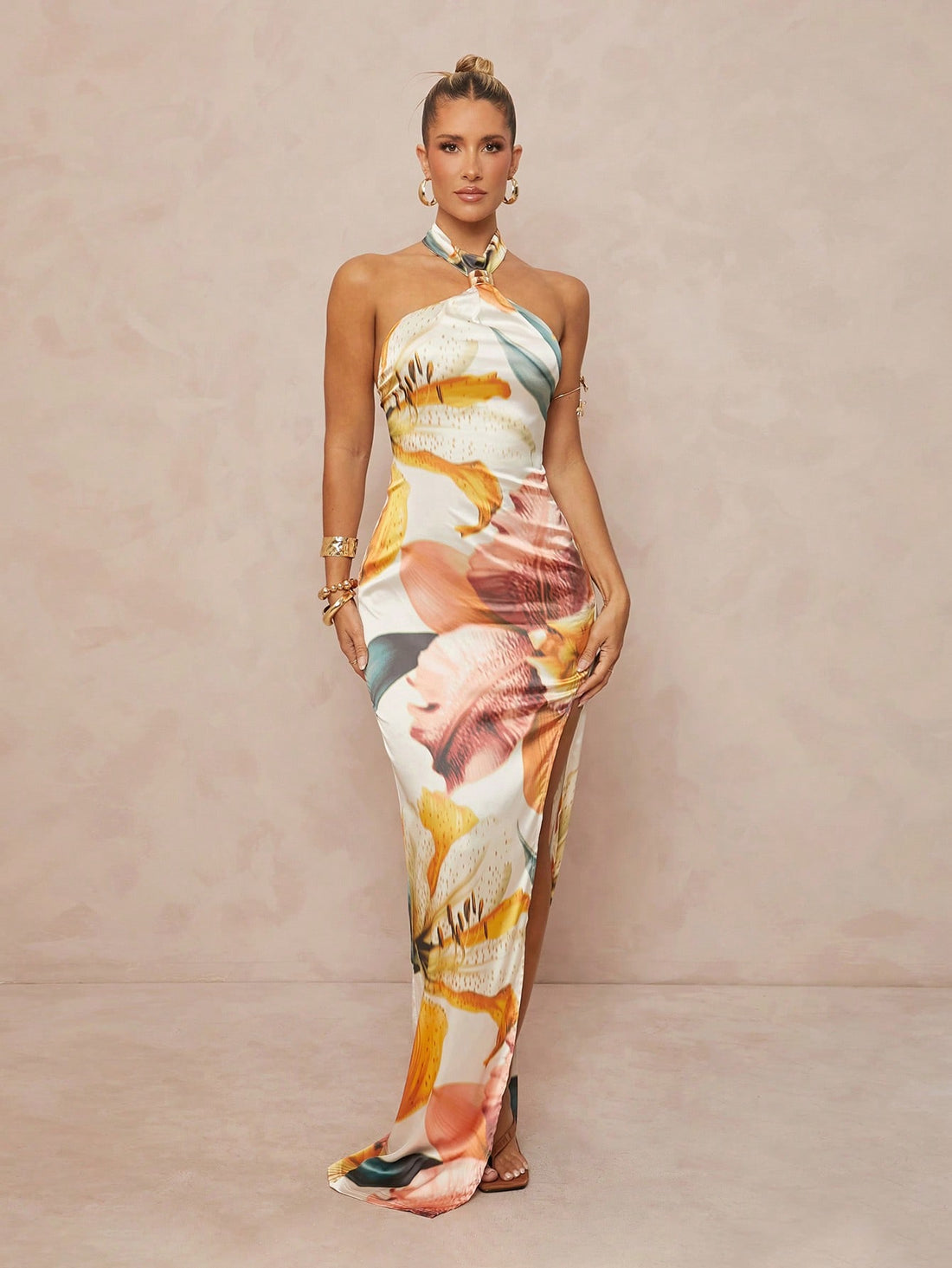 Step out in style with this Chic Oversized Floral Print Neck Tie Dress, designed for free spirits who love a touch of elegance. The bold floral print and flowing oversized fit bring bohemian vibes, while the high slit adds just the right amount of flirtiness. The neck tie detail lets you play with your look—tie it up for chic sophistication or let it flow for relaxed charm. Perfect for sunny days, festivals, or casual nights out, this dress is your go-to for effortless style and comfort.