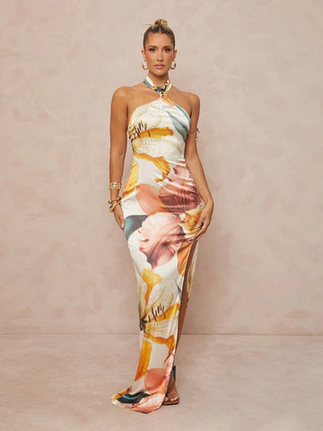 Step out in style with this Chic Oversized Floral Print Neck Tie Dress, designed for free spirits who love a touch of elegance. The bold floral print and flowing oversized fit bring bohemian vibes, while the high slit adds just the right amount of flirtiness. The neck tie detail lets you play with your look—tie it up for chic sophistication or let it flow for relaxed charm. Perfect for sunny days, festivals, or casual nights out, this dress is your go-to for effortless style and comfort.