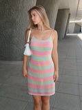 Effortlessly slay in this Chic Pastel Striped Cami Sweater Dress. Perfect for summer days, this dress features a stylish striped design and comfortable cami cut. Express your unique style with ease (and comfort!) in this must-have summer piece.