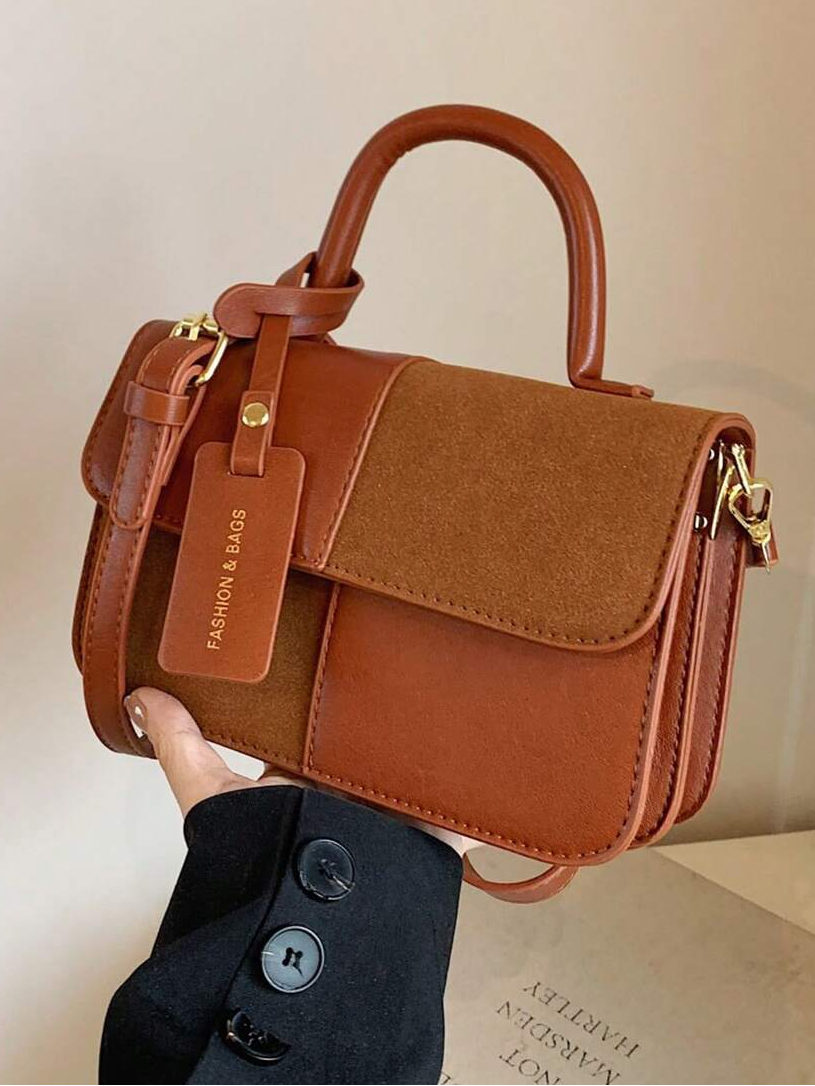 Elevate your everyday style with this chic patchwork handbag, designed for modern versatility. The adjustable strap transitions seamlessly from crossbody to shoulder carry, adapting to your mood and occasion. Whether you're heading to the shops, attending a party, or enjoying a date night, this bag combines thoughtful design with practical functionality. The patchwork detailing adds visual interest and personality, while the spacious interior keeps your essentials organized. 