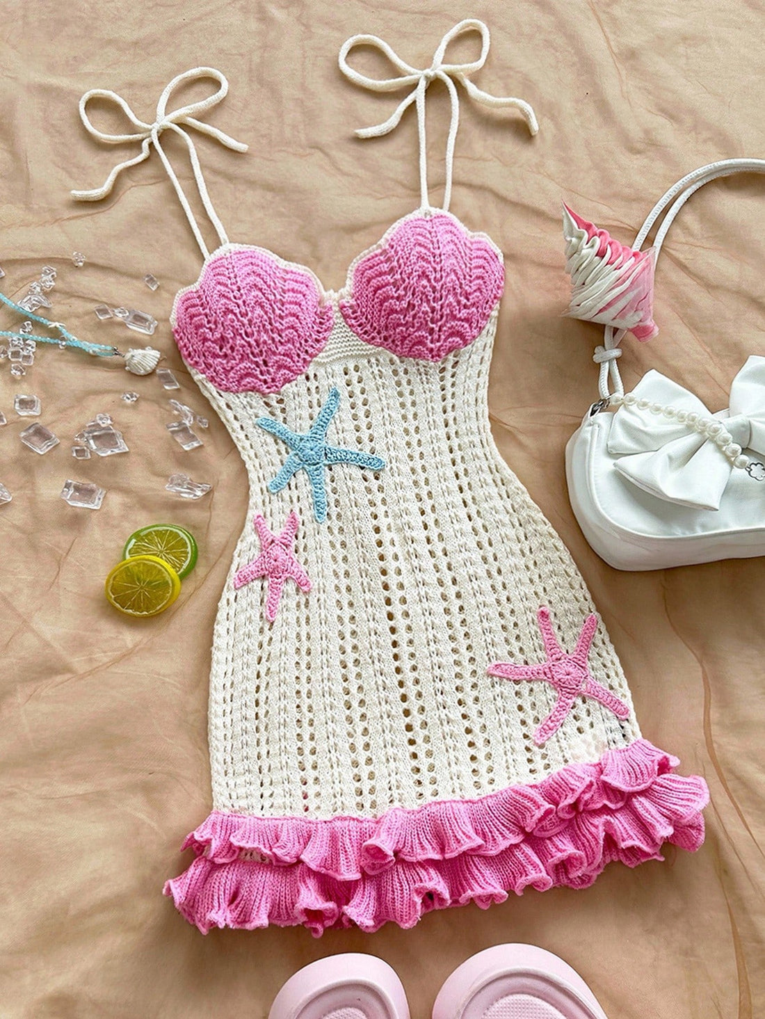 Turn heads wherever you go in this Chic Peach Starfish Halter Knit Dress. Featuring a playful halter neckline and a flirty double ruffle hem, it’s perfect for beach days, weddings, or your next vacation getaway. Soft knit fabric ensures comfort while the peach starfish pattern adds a fun, summery vibe. Get ready to feel breezy and fabulous all day long!