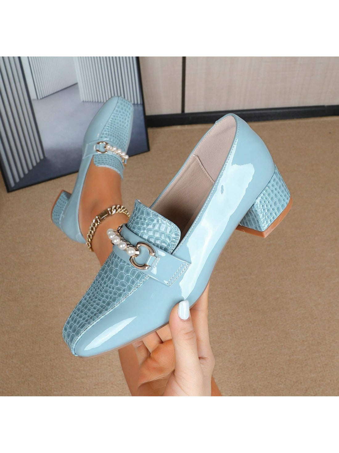 These elegant loafer flats feature chic pearl accents and a chunky heel, making them a versatile choice for any season. Their unique design adds a touch of sophistication to any outfit, while also providing comfortable support. Perfect for any fashion-forward individual looking to elevate their style.