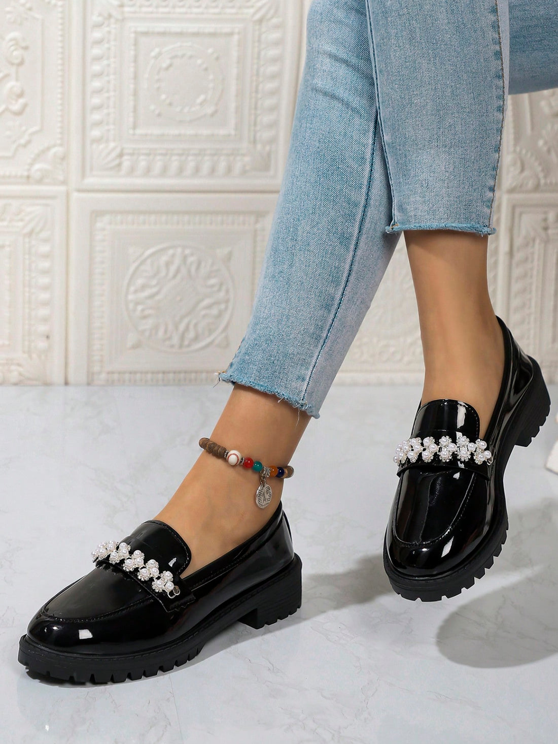 Step into style with our Chic Pearl-Embellished Chunky Platform Loafers! These trendy British shoes are perfect for Fall/Winter 2024. With a chunky platform and pearl accents, you'll be the talk of the town. Elevate any outfit with ease and stand out from the crowd. (Put your best foot forward with these cheeky loafers!)