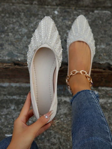 Step into effortless elegance with these pearl-embellished flat shoes that blend timeless charm with modern style. Featuring delicate pearl accents that catch the light beautifully, these versatile flats transition seamlessly from casual outings to dressed-up occasions. The comfortable flat sole keeps you feeling fabulous all day long, while the sophisticated design pairs perfectly with everything from jeans to dresses. Whether you're embracing spring freshness or autumn warmth, these shoes are your go-to c