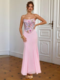 Turn heads this season in our stunning pink strapless dress, where dimensional floral details meet flattering silhouette. The fitted bodice hugs your curves perfectly, while the dramatic fishtail hem adds a touch of glamour and movement with every step. Whether you're heading to a summer date night or jetting off on vacation, this show-stopping piece delivers the perfect blend of elegance and fun. Pair it with strappy heels and minimal jewelry to let the dress do the talking!