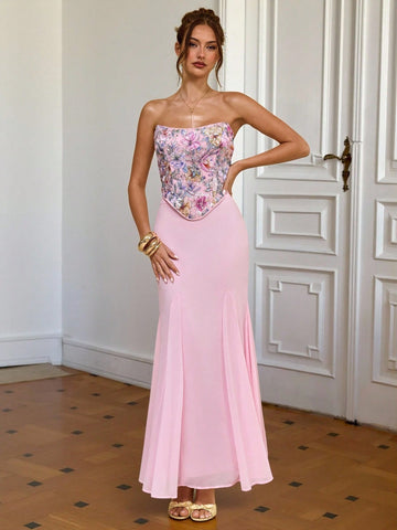Turn heads this season in our stunning pink strapless dress, where dimensional floral details meet flattering silhouette. The fitted bodice hugs your curves perfectly, while the dramatic fishtail hem adds a touch of glamour and movement with every step. Whether you're heading to a summer date night or jetting off on vacation, this show-stopping piece delivers the perfect blend of elegance and fun. Pair it with strappy heels and minimal jewelry to let the dress do the talking!