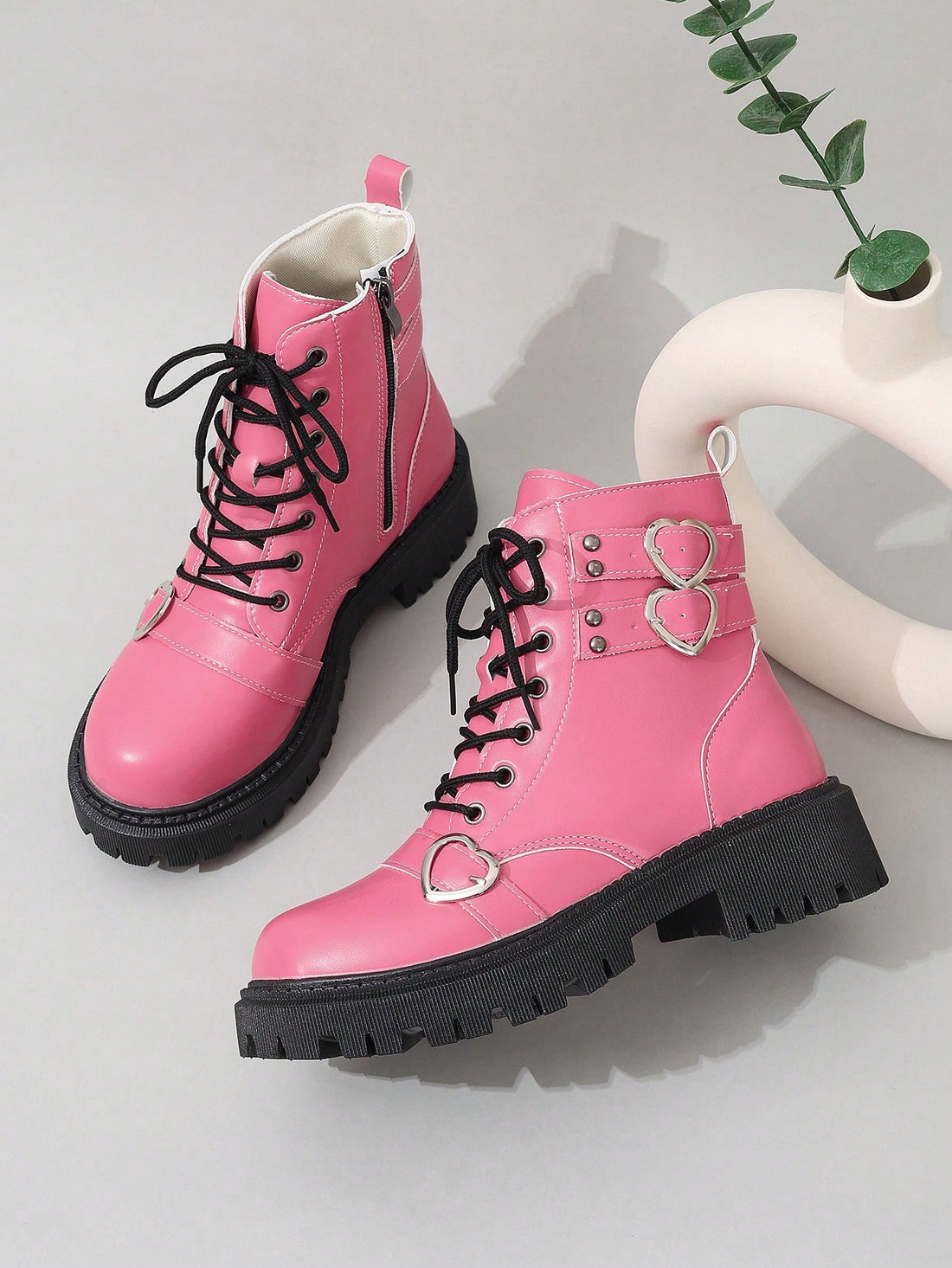 Enhance your spring and autumn wardrobe with these chic and trendy Chic Pink Grunge Punk Studded Heart Lolita Boots. Made with high-quality materials, these boots feature a unique studded heart design that adds a touch of punk and grunge to your style. Perfect for both fashion-forward and edgy looks, these boots are a must-have for any trendy girl.