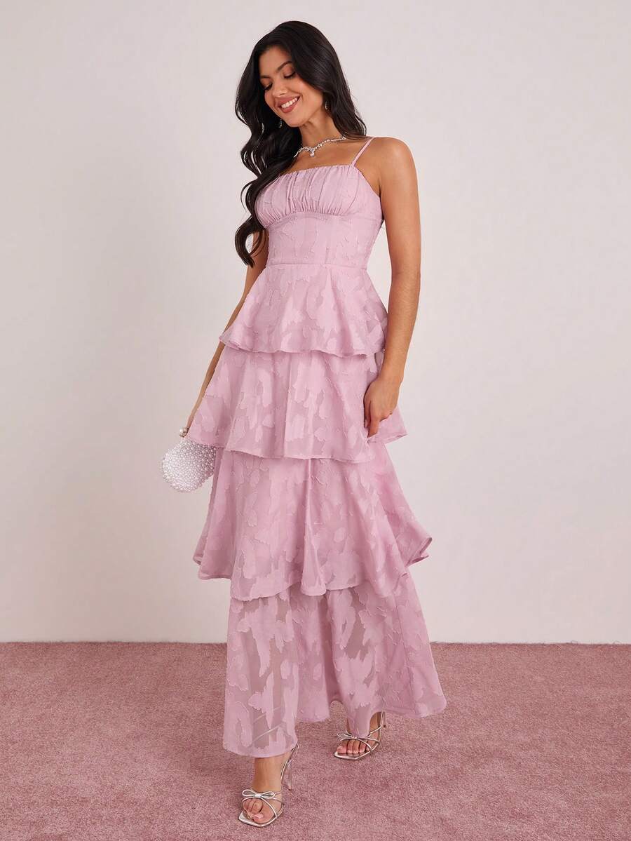 Elevate your wardrobe with this stunning pink jacquard maxi dress, designed for effortless elegance. The ruched bust detail creates a flattering silhouette while the flowing maxi length offers timeless sophistication. Perfect for romantic dates, spring getaways, or any occasion calling for refined style. The jacquard fabric adds texture and visual interest, making this dress a versatile piece that transitions seamlessly from day to evening. Comfortable yet chic