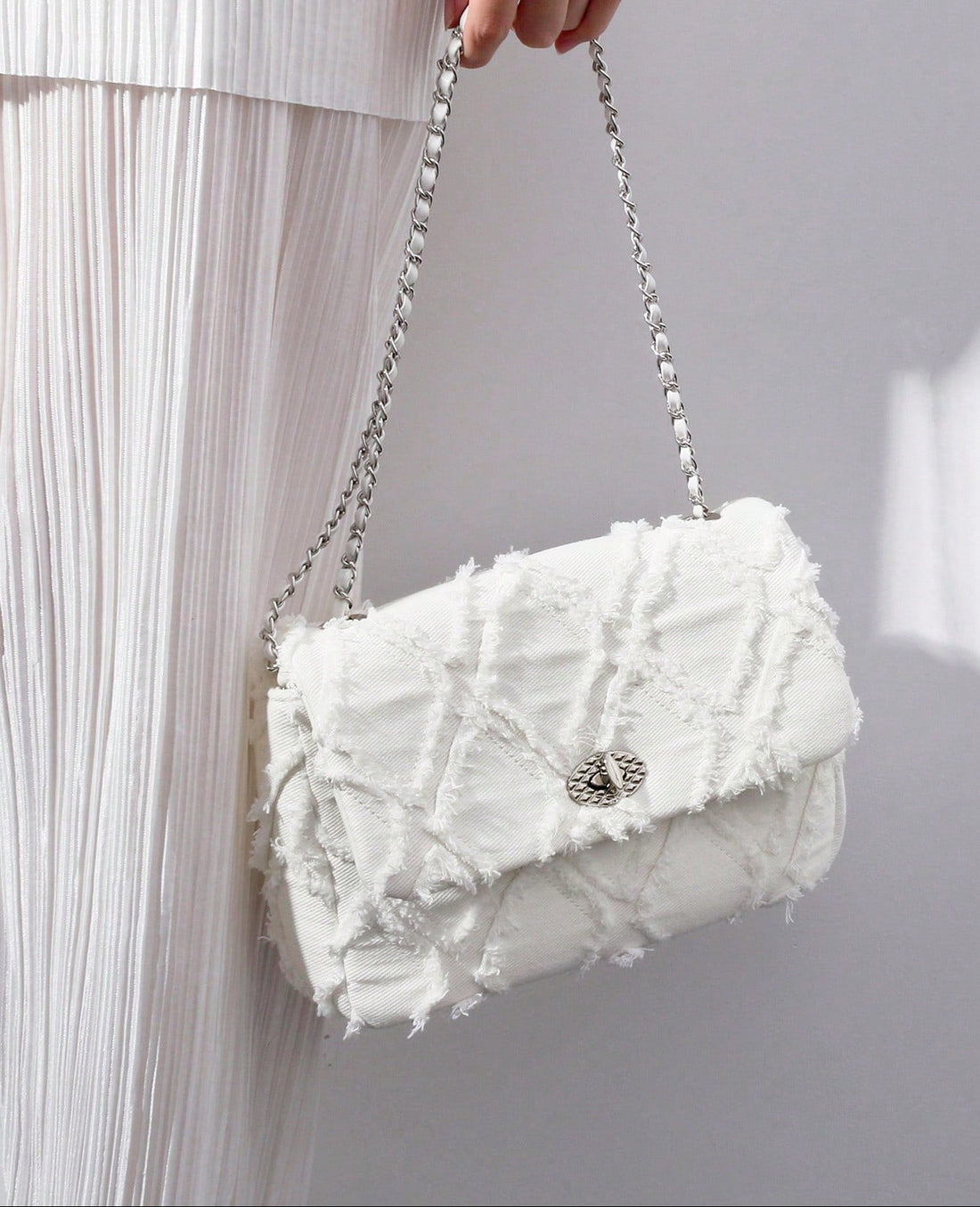 Elevate her accessory game with this adorable pink quilted crossbody bag! Handcrafted with charming fringe details and a secure lock closure, it's the perfect blend of style and function. The soft quilted texture adds a touch of sophistication, while the playful pink hue keeps things fun and fresh. Ideal for everyday adventures or special occasions, this bag makes a thoughtful gift that'll have her reaching for it again and again. Compact yet spacious, it's designed to carry all her essentials in style.