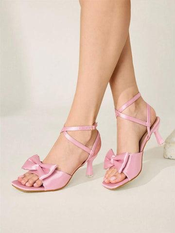 Elevate your special occasions with these stunning pink satin bow high heel sandals. Featuring a chic square toe design and secure ankle strap, these stiletto heels deliver effortless elegance for banquets, parties, and festive celebrations. The mid-heel height offers comfortable all-day wear, while the soft fabric upper and durable rubber sole ensure lasting quality. Perfect for Valentine's Day, New Year's Eve, or any event where you want to make a sophisticated statement. Slip into luxury and confidence w