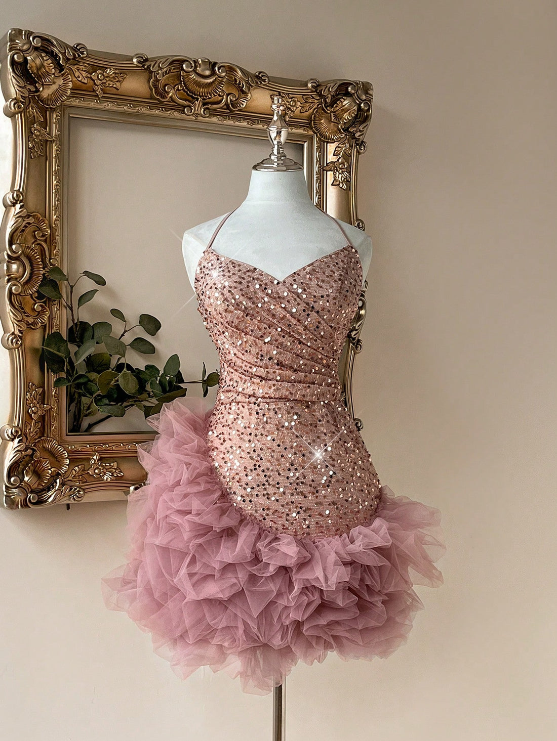 Elevate your event look with this stunning chic pink sequin halter party dress. Crafted from shimmering sequins, this mini dress features a flattering slim fit with delicate spaghetti straps and a charming halter neckline. The ruffle and cup details add romantic flair, while the fully lined construction ensures comfort and confidence. Perfect for weddings, formal occasions, and photoshoots, this baby pink beauty combines sparkle with sophistication.