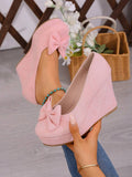 Elevate your spring wardrobe with these stunning pink wedge slip-ons, the perfect fusion of comfort and sophistication. The delicate bowknot accent adds a touch of feminine charm, while the slip-on design means you can slip them on and go. Built with premium suede leather uppers and a supportive PU leather lining, these court wedges deliver both durability and softness underfoot. The high wedge heel provides a graceful lift without sacrificing stability, making them ideal for work, weekend outings, or cozy 