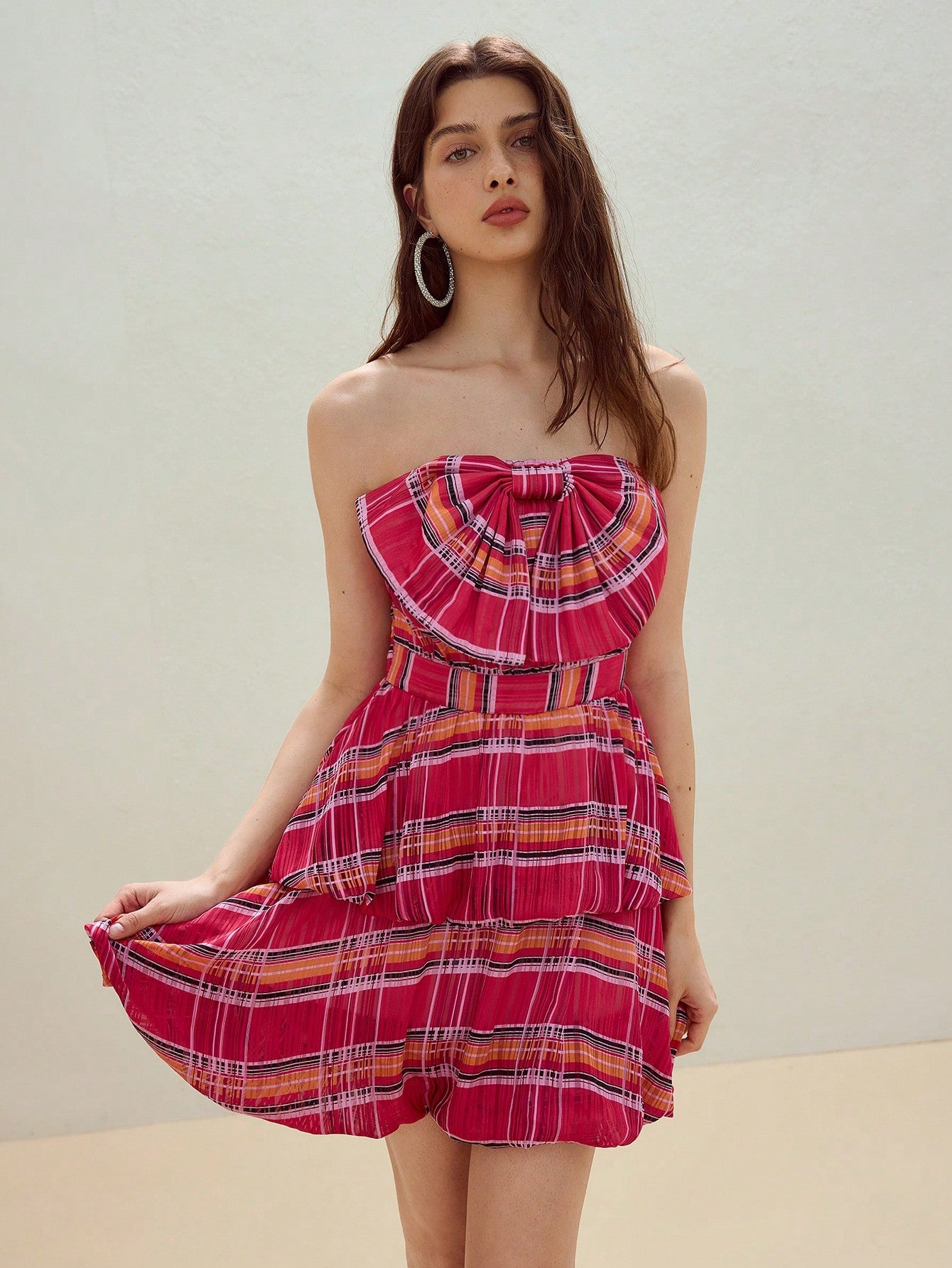 Step out in playful charm with this Chic Plaid Bow Decor Tube Puffball Dress. Featuring a fun puffball silhouette and a stylish plaid pattern accented by a cute bow, it’s perfect for adding effortless flair to your wardrobe. Whether for a casual day out or a lively gathering, this dress brings a touch of whimsy and comfort to your look.