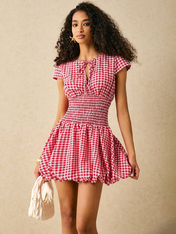 Get ready to turn heads in our Chic Plaid Halter Mini Dress! Featuring a cinched waist, this dress is perfect for casual vacations. Pair with sandals for a relaxed look or dress it up with heels for a night out. Who says vacation fashion can't be stylish?